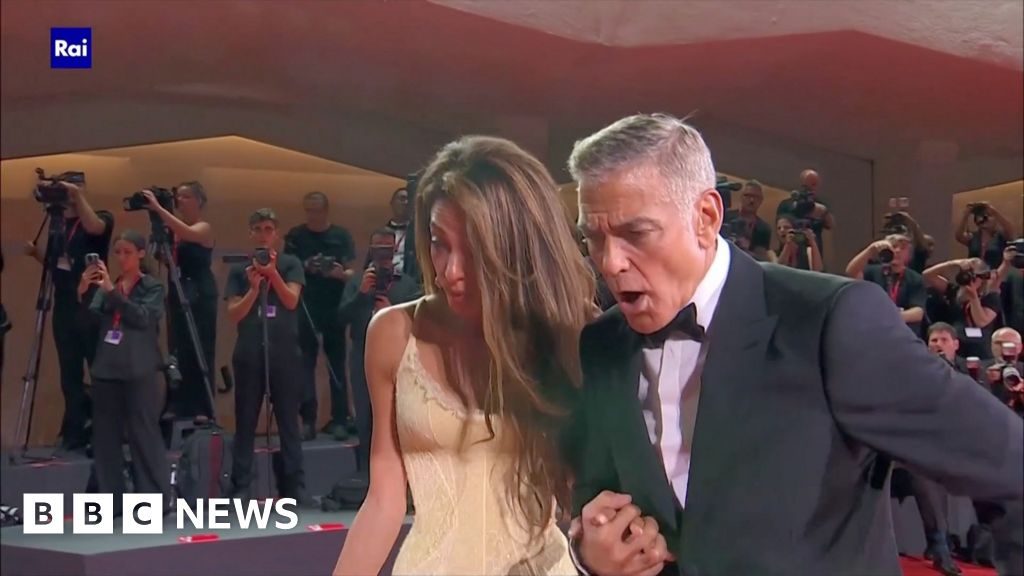 Clooney hjälper fallen fotograf på filmfestivalen i Venedig